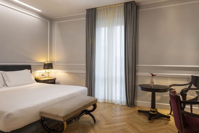 Une chambre De Luxe au décor contemporain épuré - Photo : Benedetto Tarantino/Mangia's