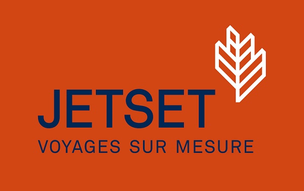 Le nouveau logo de Jetset Voyages décliné ici avec un fond orangé rouge et une police bleu marine - DR