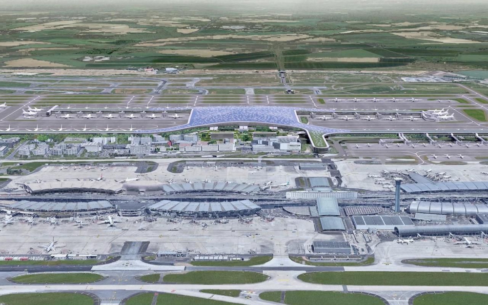 Vision d'architecte du nouveau Terminal 4 de Roissy (au second plan). Au premier plan, l'actuel terminal 2 © ADP Vision d'architecte du nouveau Terminal 4 de Roissy (au second plan). Au premier plan, l'actuel terminal 2 © ADP