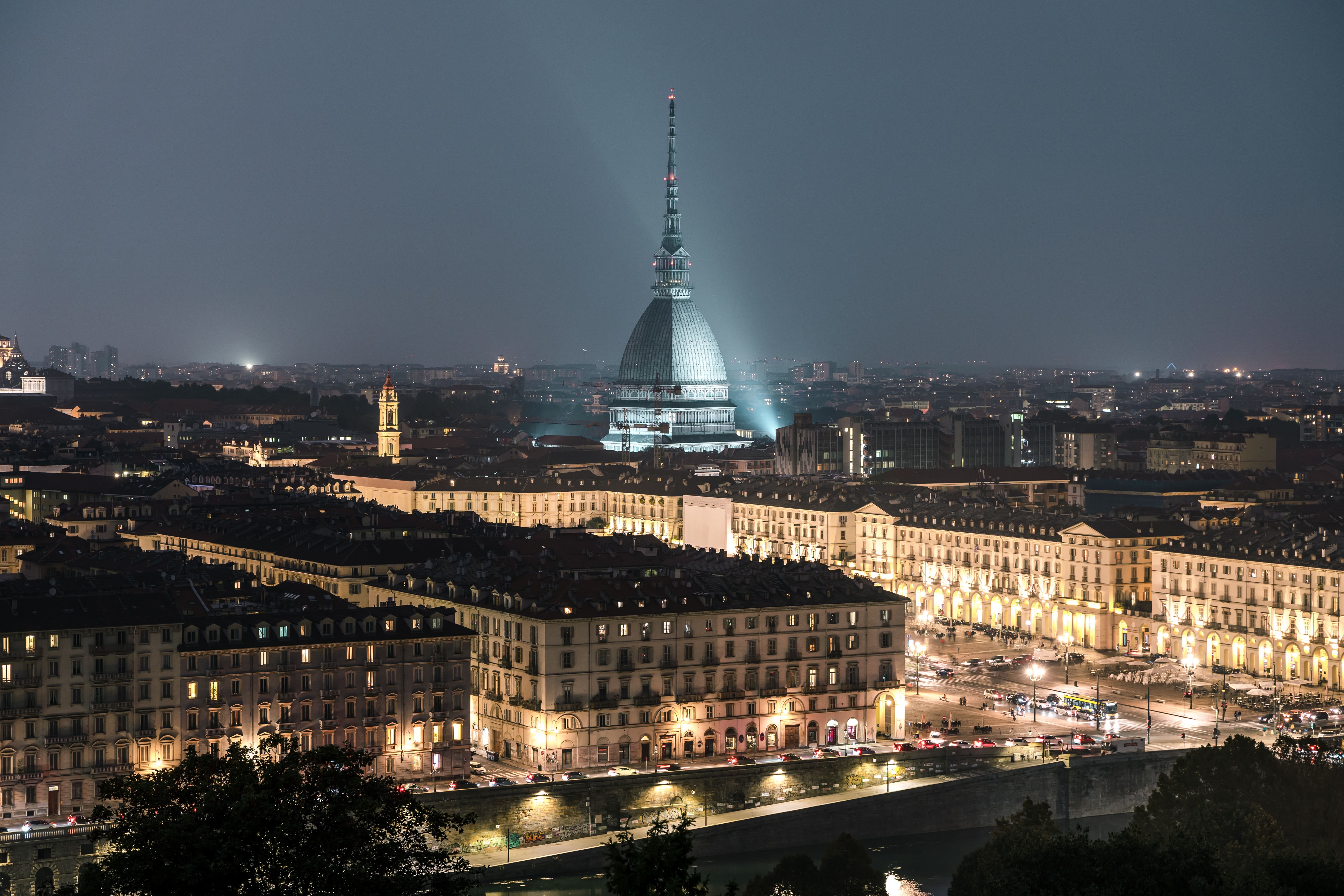 The city of Turin at sunset, splendid view of the Mole Antonelliana when the city lights up © Fernando - stock.adobe.com